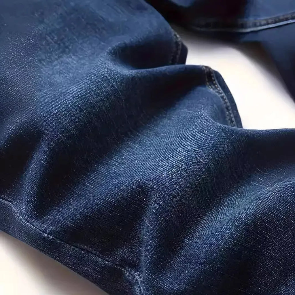 Men's dark blue slim casual jeans with street fashion styling and mid waist design