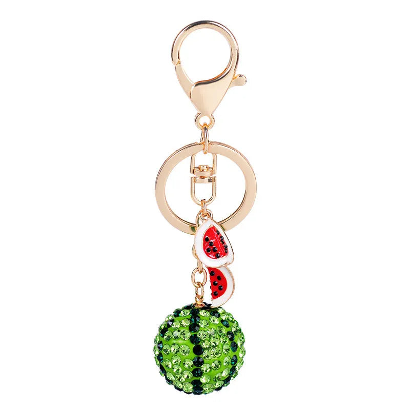 Green zinc alloy watermelon keychain measuring 12 cm in length.