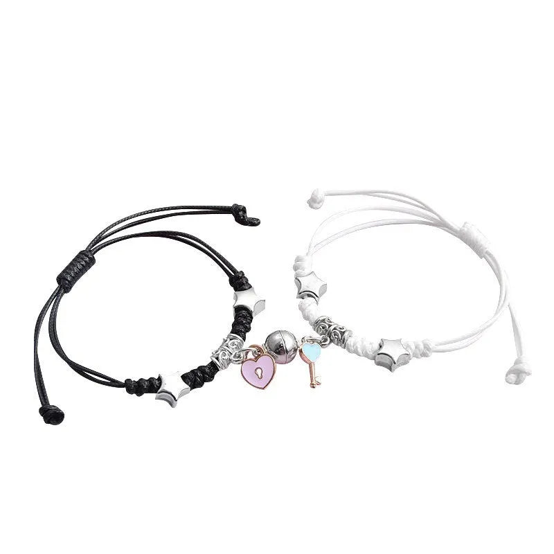 Magnetic clasp couple bracelets with alloy construction and symbolic designs including crown and love lock motifs.