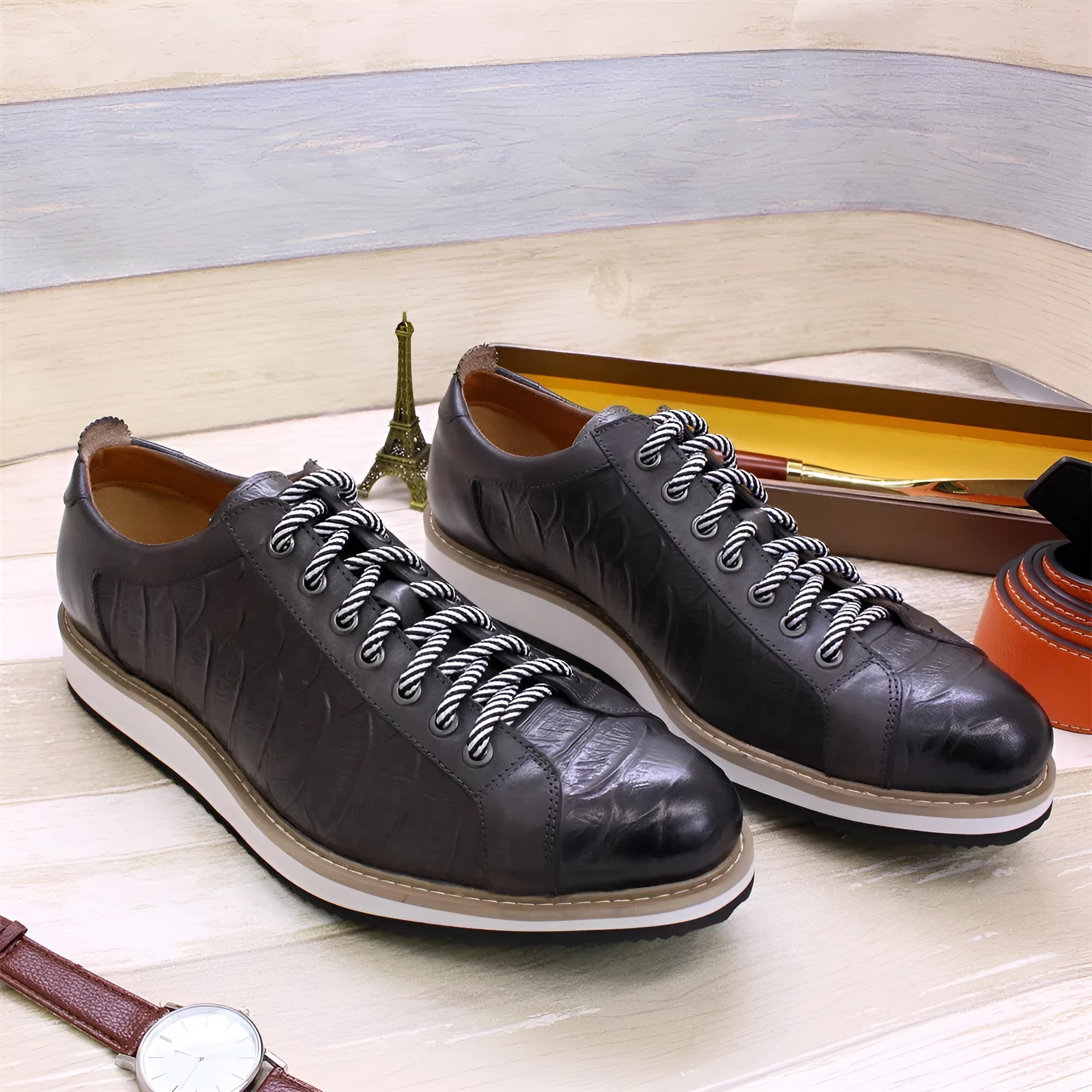 Men's low-top handmade casual shoes with an embossed pattern and front lace closure.