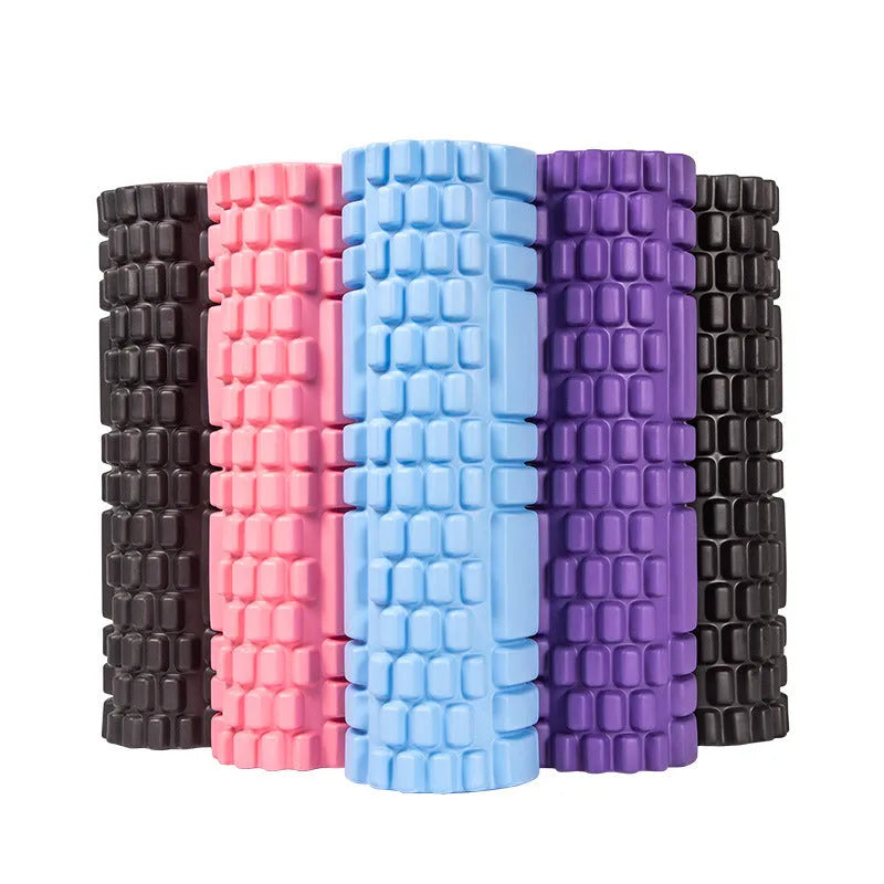 EVA foam roller for fitness in various colours and sizes on a gym floor.