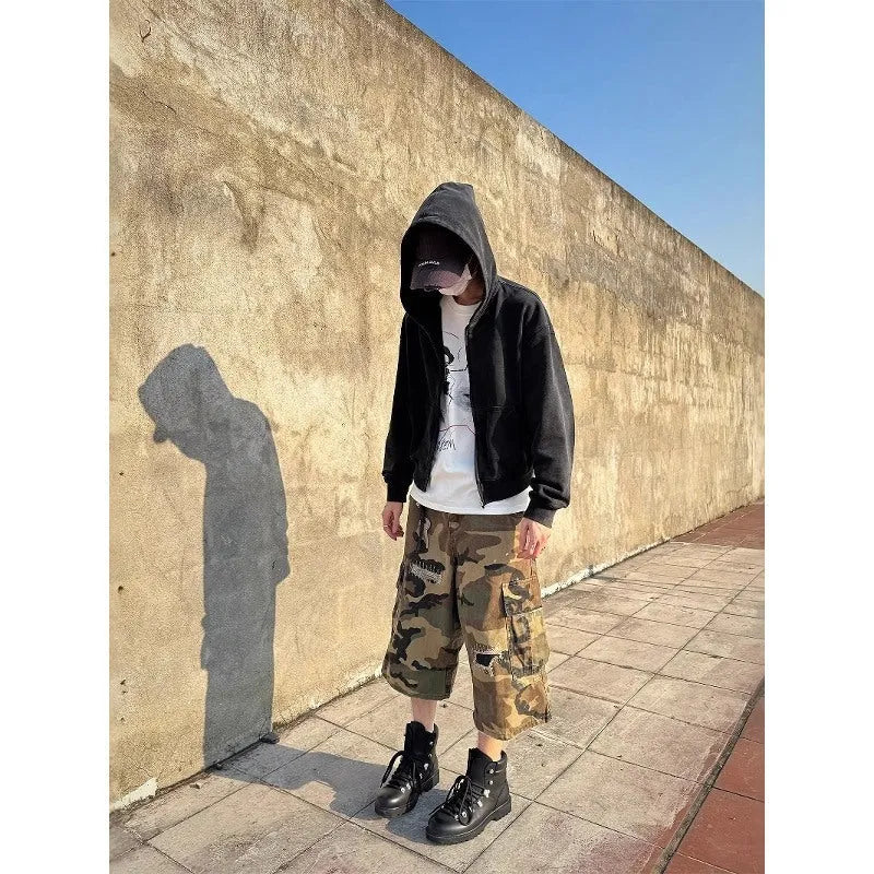 Men's loose straight leg jeans in camouflage colour with ripped patch details and a cropped ankle length
