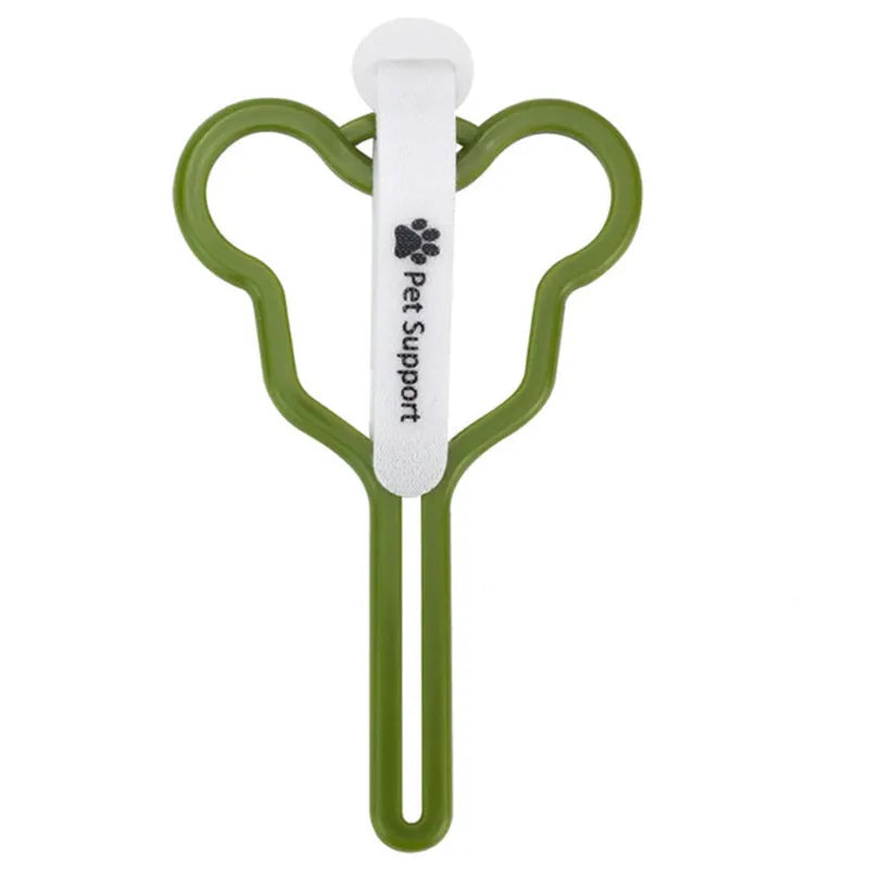 A coloured hands-free dog poop bag holder with a fixed clip and velcro strap attached to a dog leash.