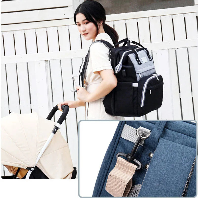 Multifunctional maternity diaper backpack with removable foldable crib in green Oxford fabric