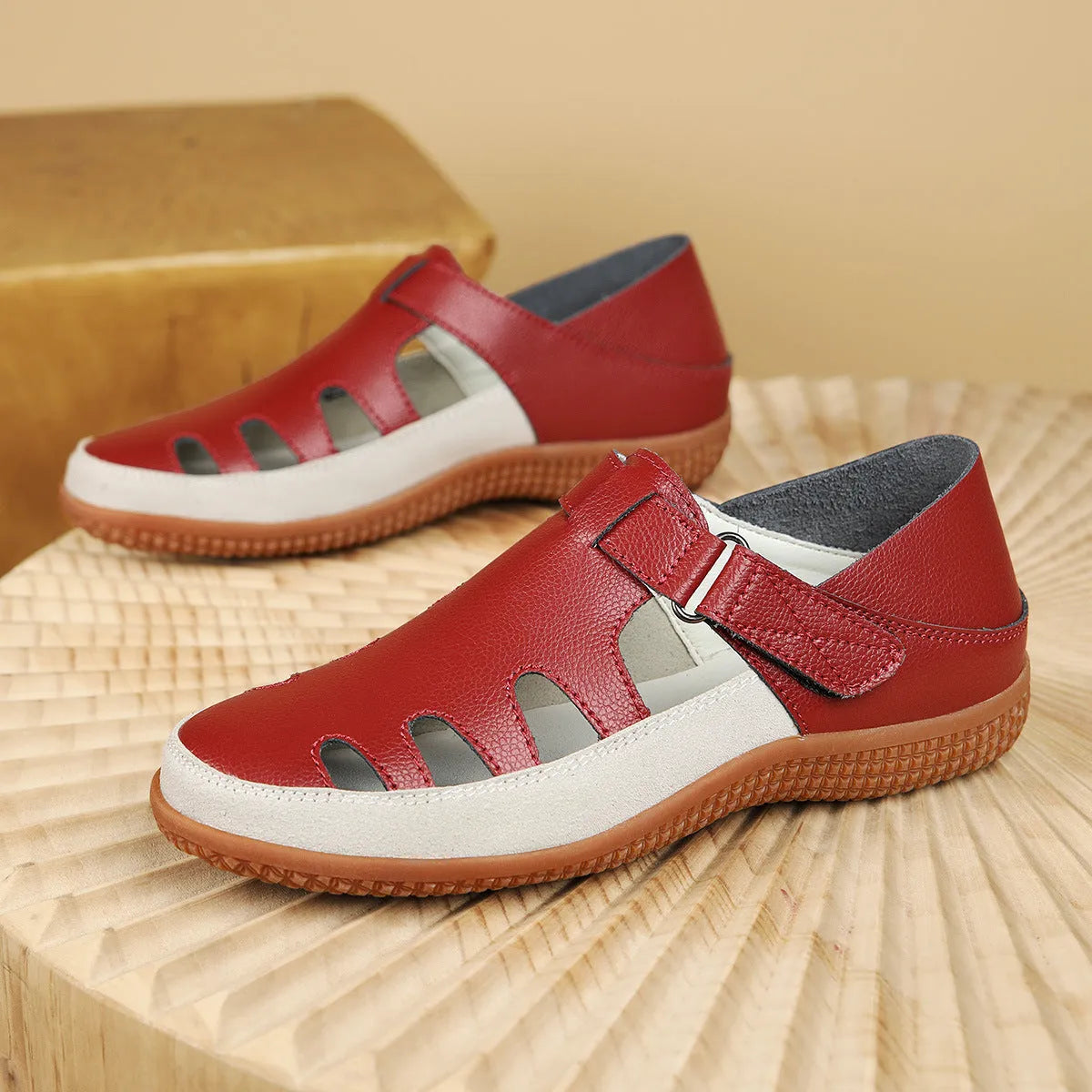 Women's plus size flat heel sandals with hollow toe cap in blue, red, or white on a thick rubber sole.