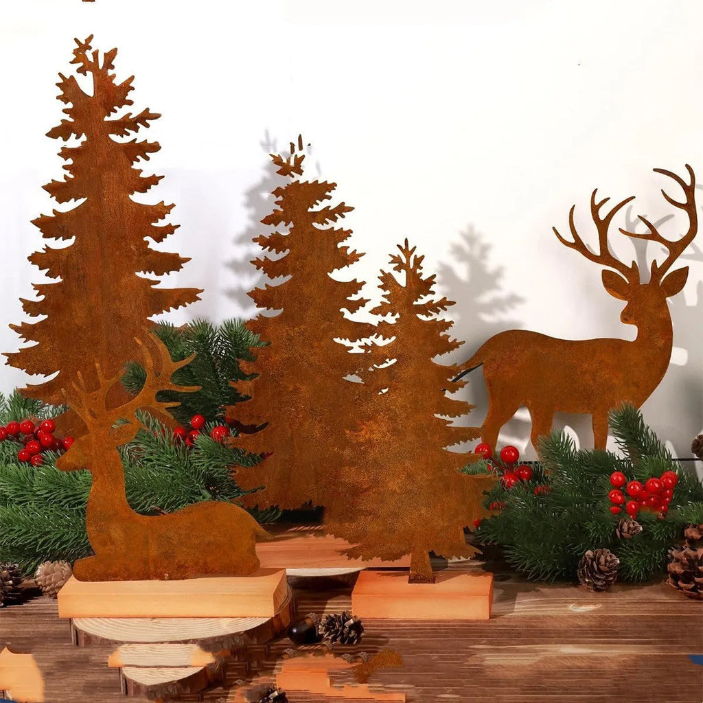 Set of three rusty iron elk and Christmas tree metal ornaments on a wooden surface.