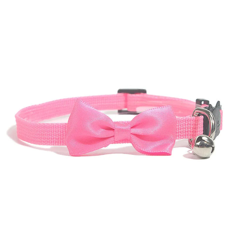 Striped multi-colour adjustable nylon cat collar with a small bell attached.