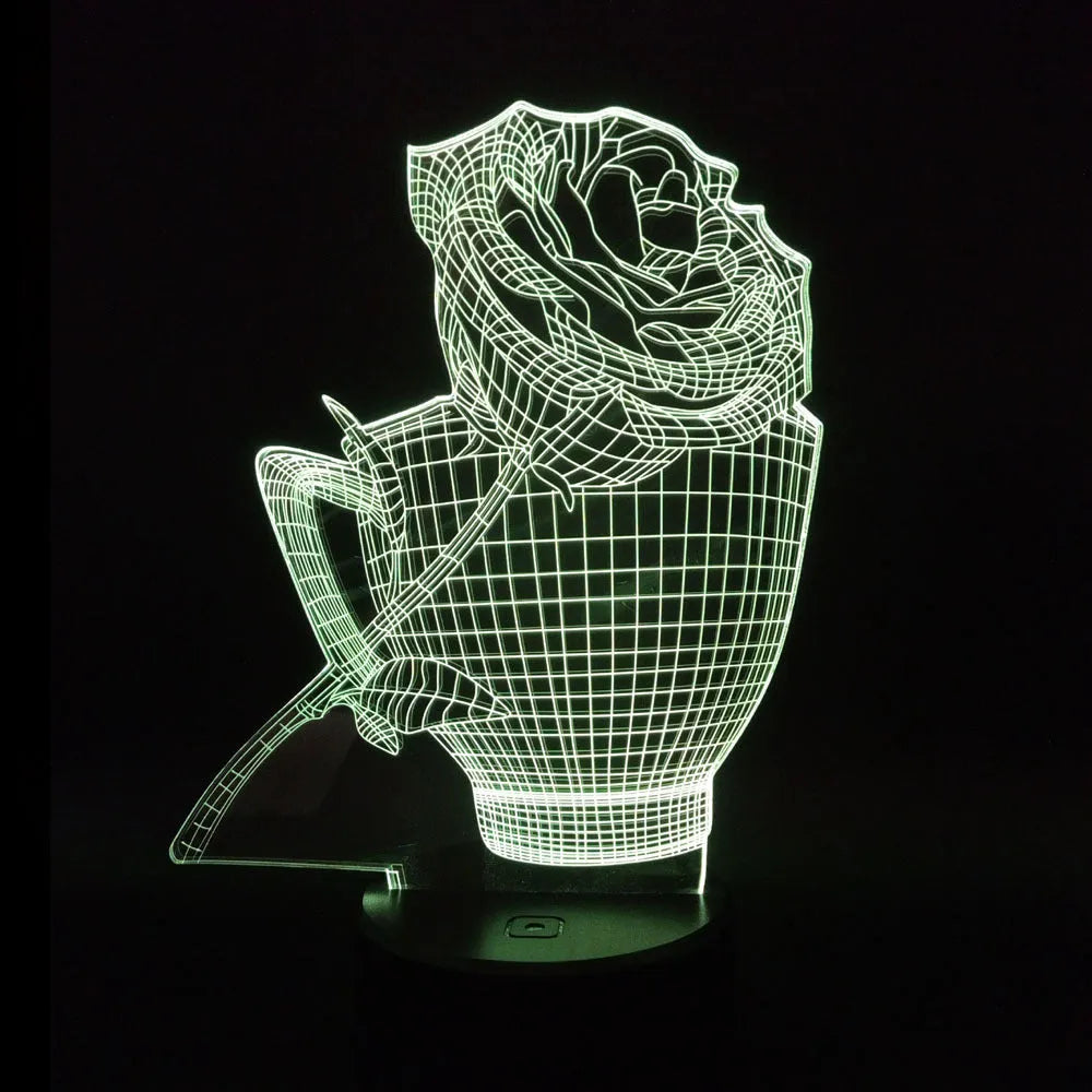 3D acrylic rose flower night light in black finish on a table, showing multicoloured LED illumination.