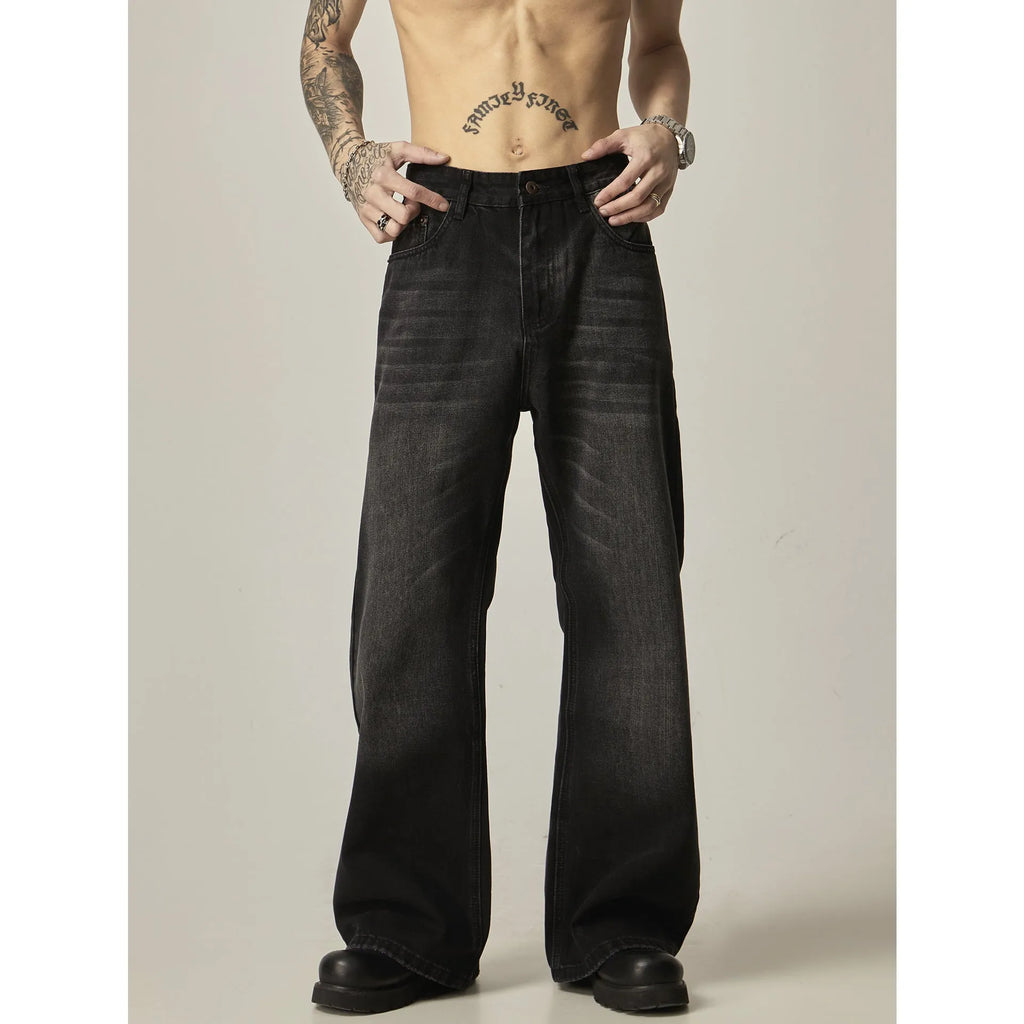 Black loose-fit straight-leg men's jeans with a zipper fly and retro styling.