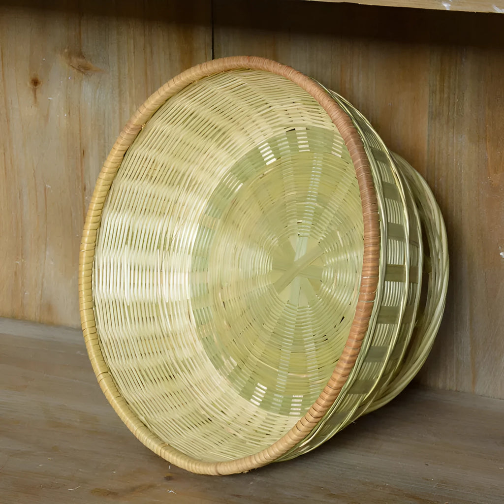 Three handmade bamboo storage baskets in different sizes including one with deepening design