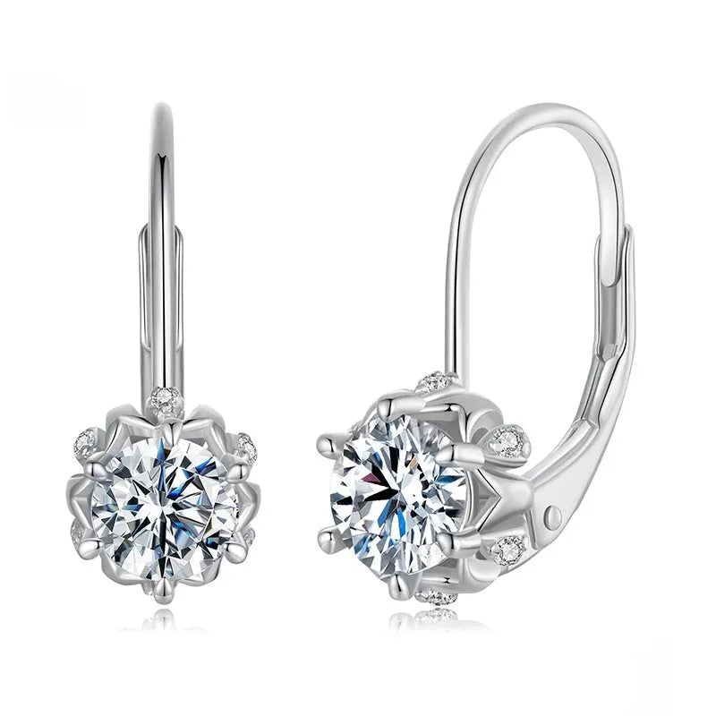 Sterling silver flower bud ear clip with white gold plating and a central moissanite stone.