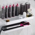 Aluminium punch-free bathroom storage rack holding 7 hair curlers in Marcel waver shape