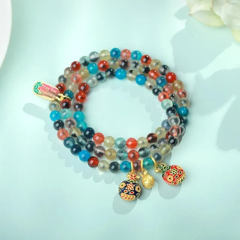 Women's agate bracelet with copper coin snake chain and coloured glaze detailing in geometric bead design