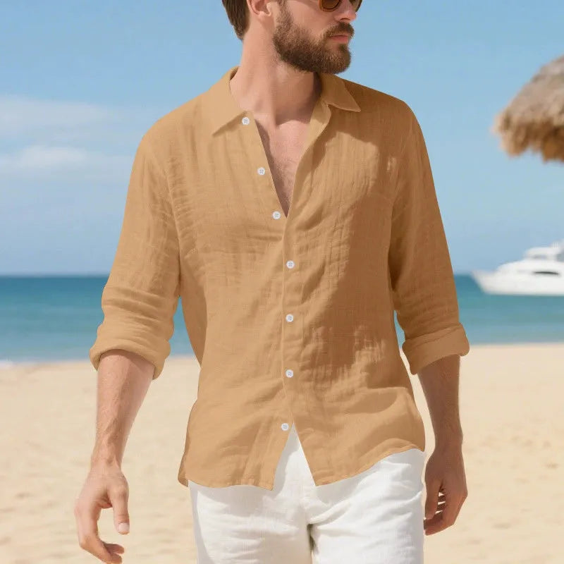 Men's loose fit linen Hawaiian casual shirt on a hanger, shown in light blue colour.