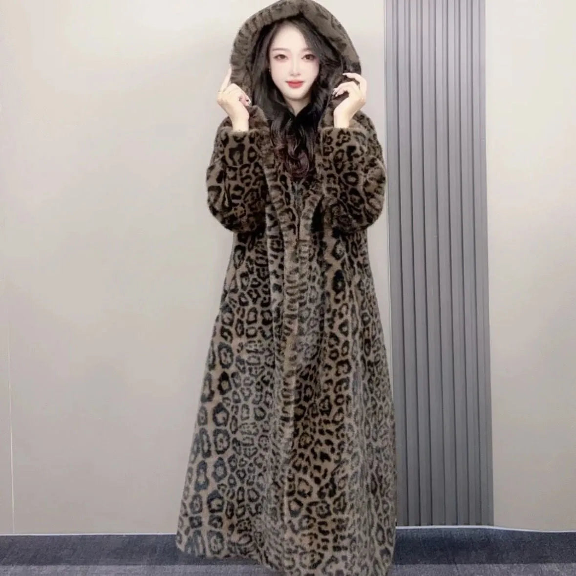 Long plus size brown leopard print faux fur coat for women on a hanger