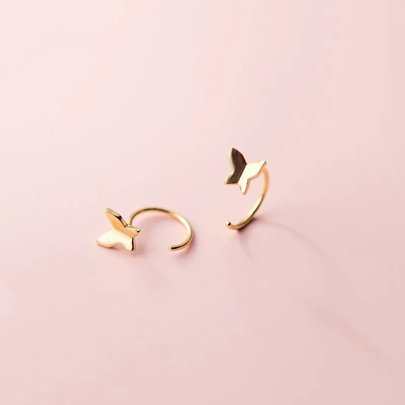 Pair of 925 silver butterfly stud earrings, 13x6mm, golden colour finish on grey background