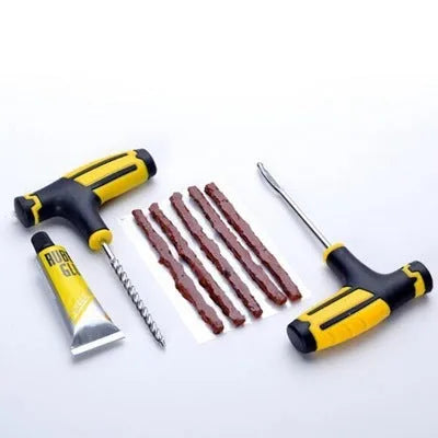 Black and yellow vacuum tire repair tool set with probe, glue, and rubber strips on a white background.