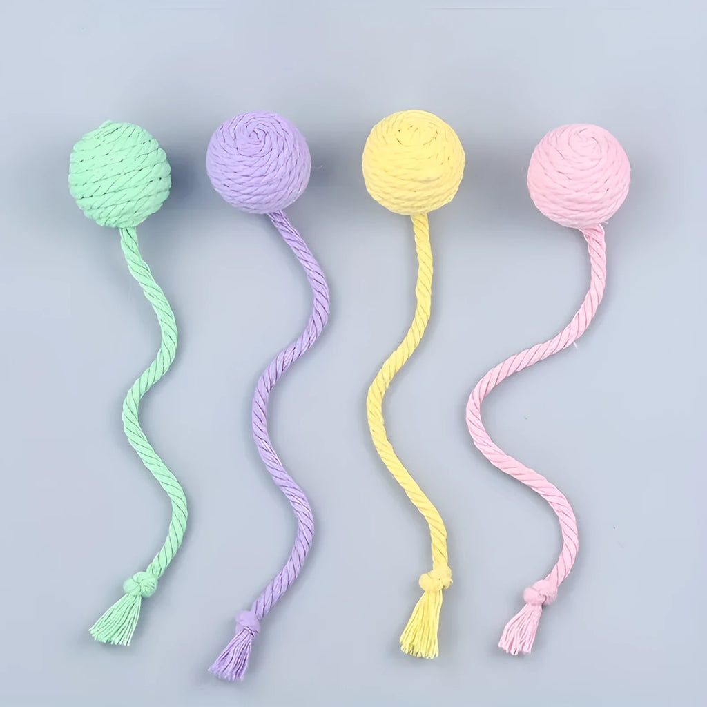 Cat toy ball with rope in four colours: green, pink, purple, and yellow