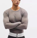 Black mesh see-through slim-fit pullover with long sleeves and a round collar.