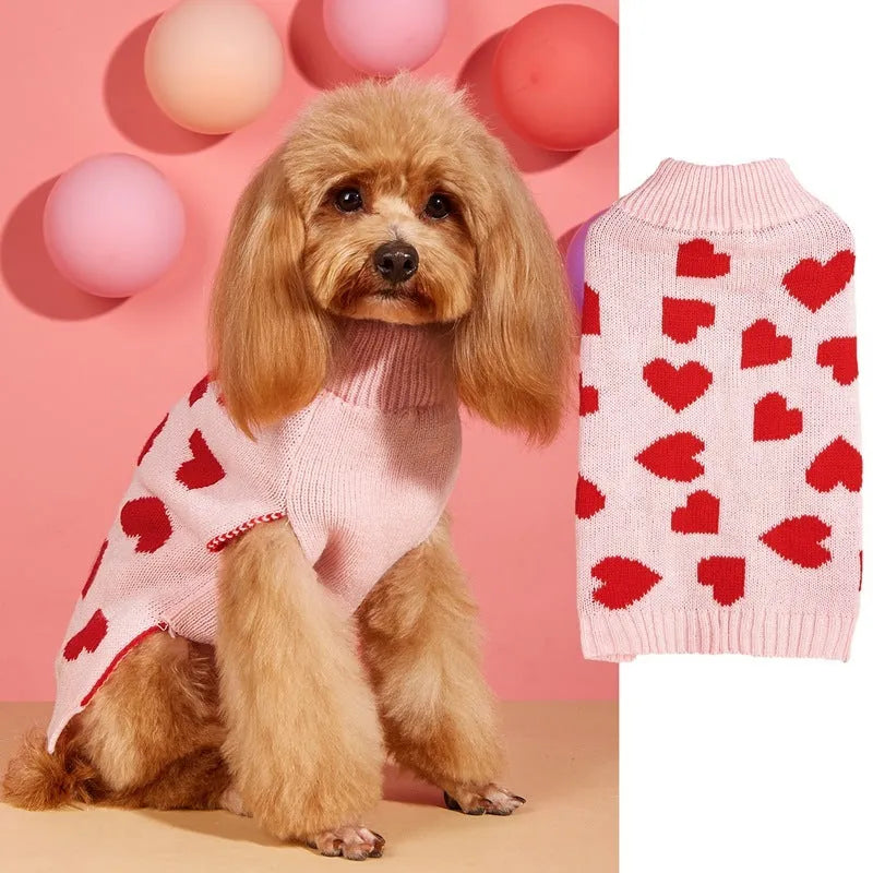 Red dog sweater with a white love heart and bow design on a small dog.