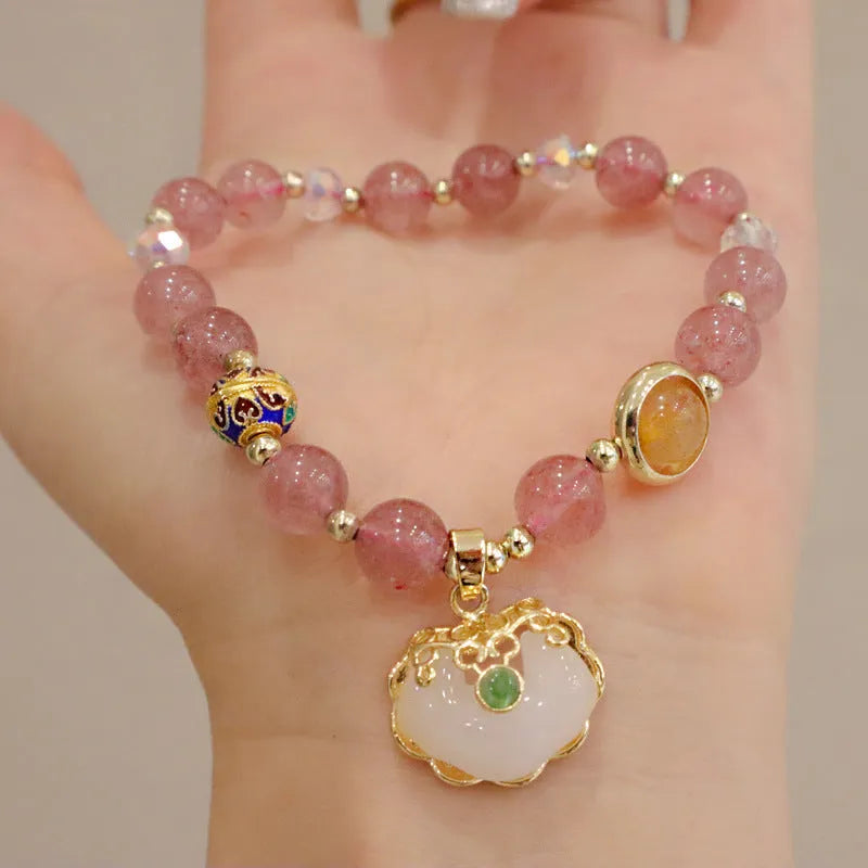 Women's bracelet with strawberry quartz and gray jade stones and ethnic metal decorations