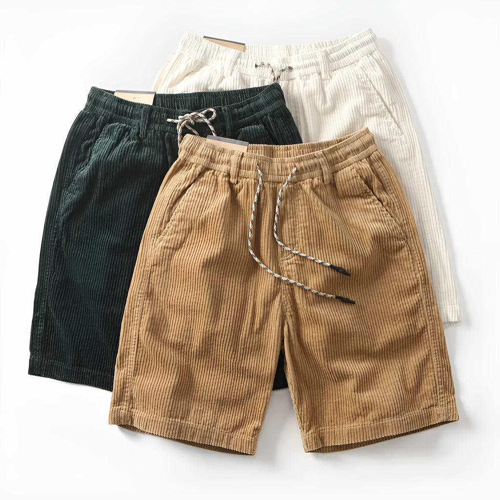Men's khaki retro-style cargo shorts with a straight leg on a summer streetwear background.