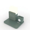 Dark green 3-in-1 wireless charging stand for phone, watch, and earbuds on a wooden table.