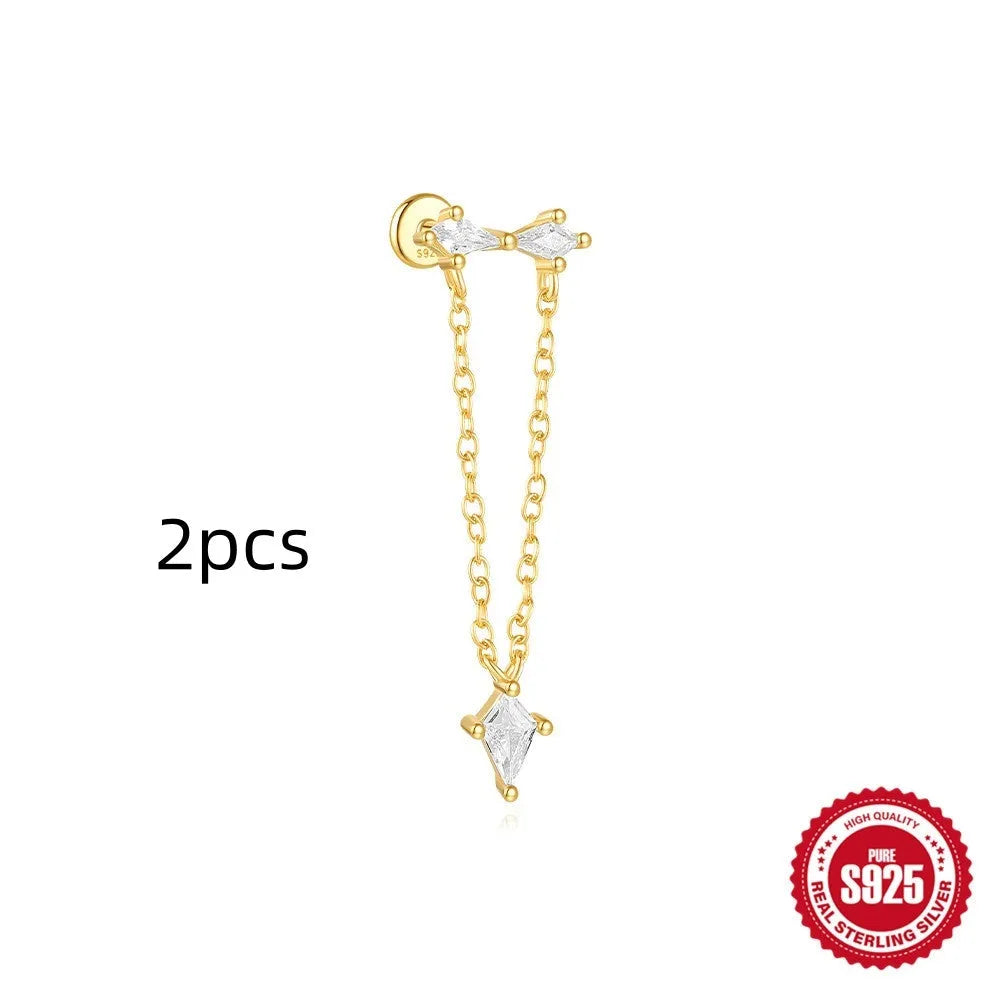 S925 sterling silver geometric kite earring with rhinestones and a chain tassel in a gold colour.