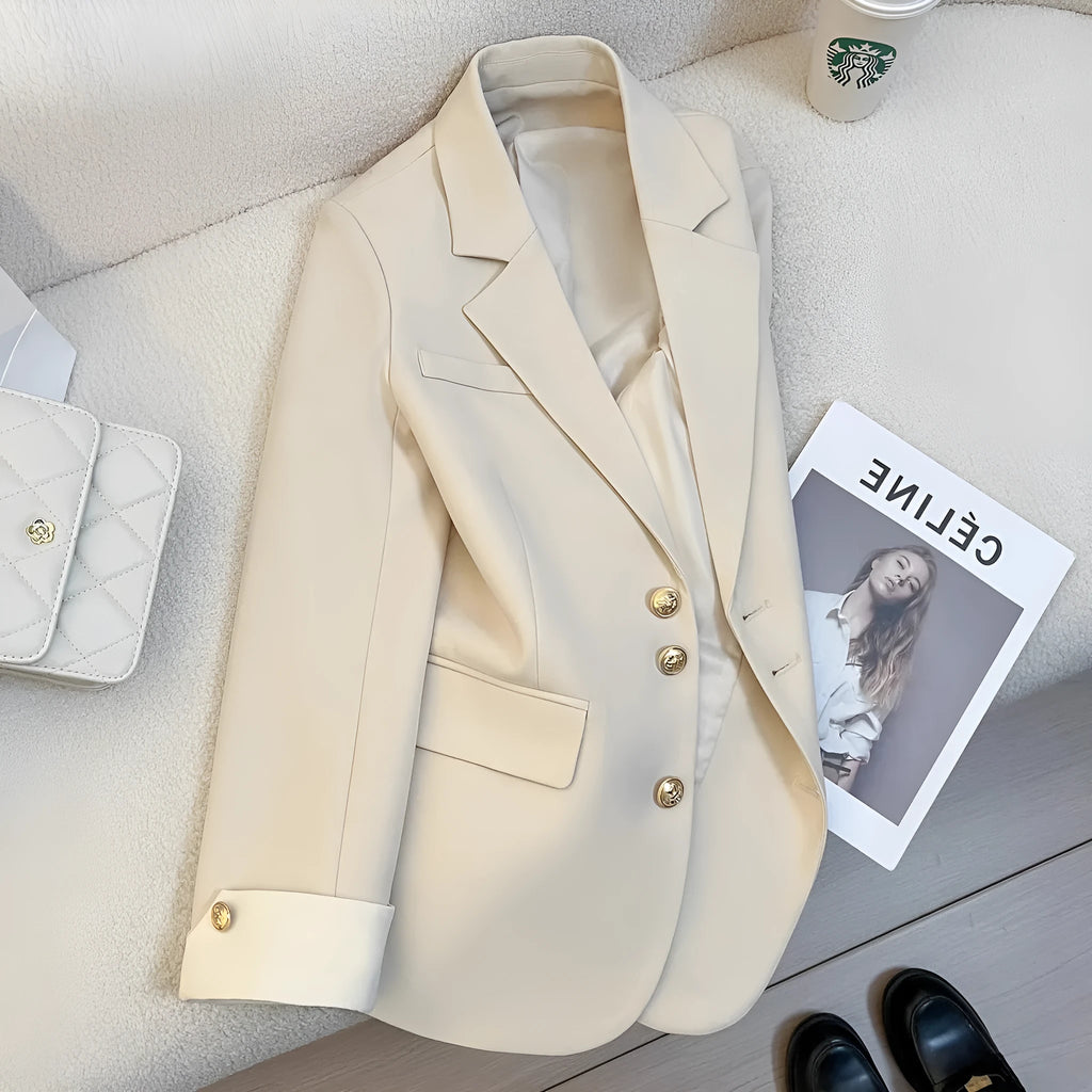 Korean-style loose-fit women's coat in beige and black, showing long sleeves and pockets.