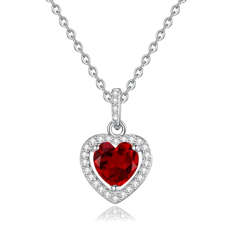 925 silver necklace with heart-shaped pendant containing natural gemstone on cross chain