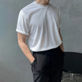 Men's slim fit black cotton t-shirt with round neck and half sleeves on a hanger