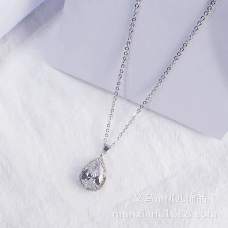 Rose gold geometric drop necklace with rhinestone details in pink colour option
