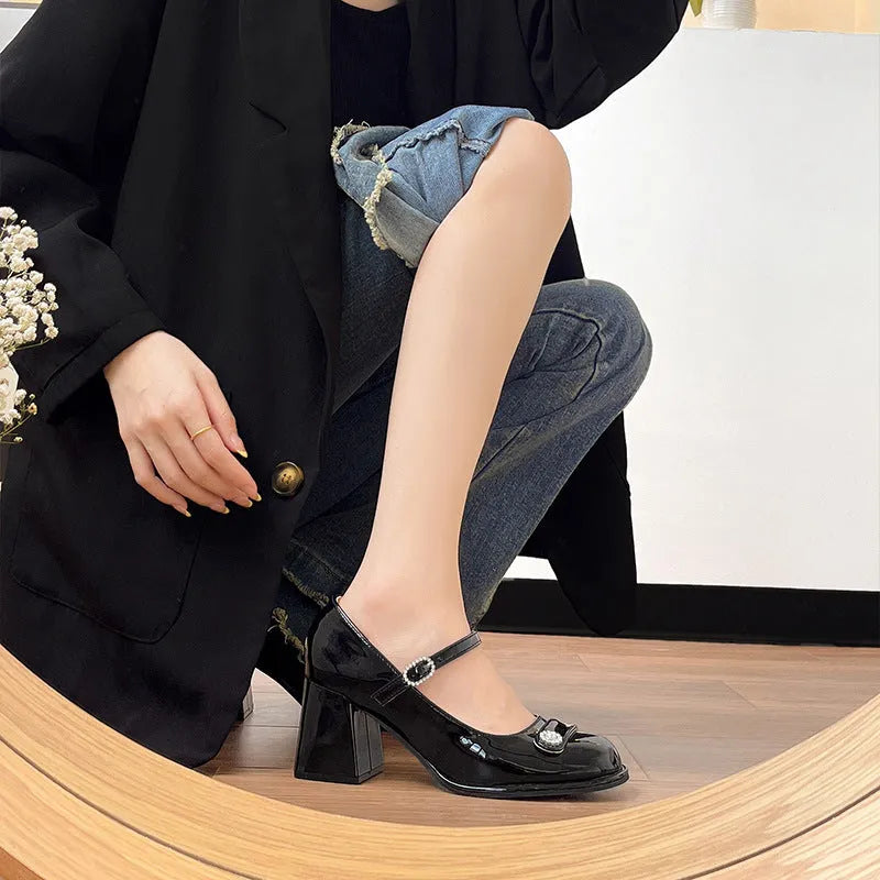 Women's black patent leather wide fit heels with chunky block heel and round toe design