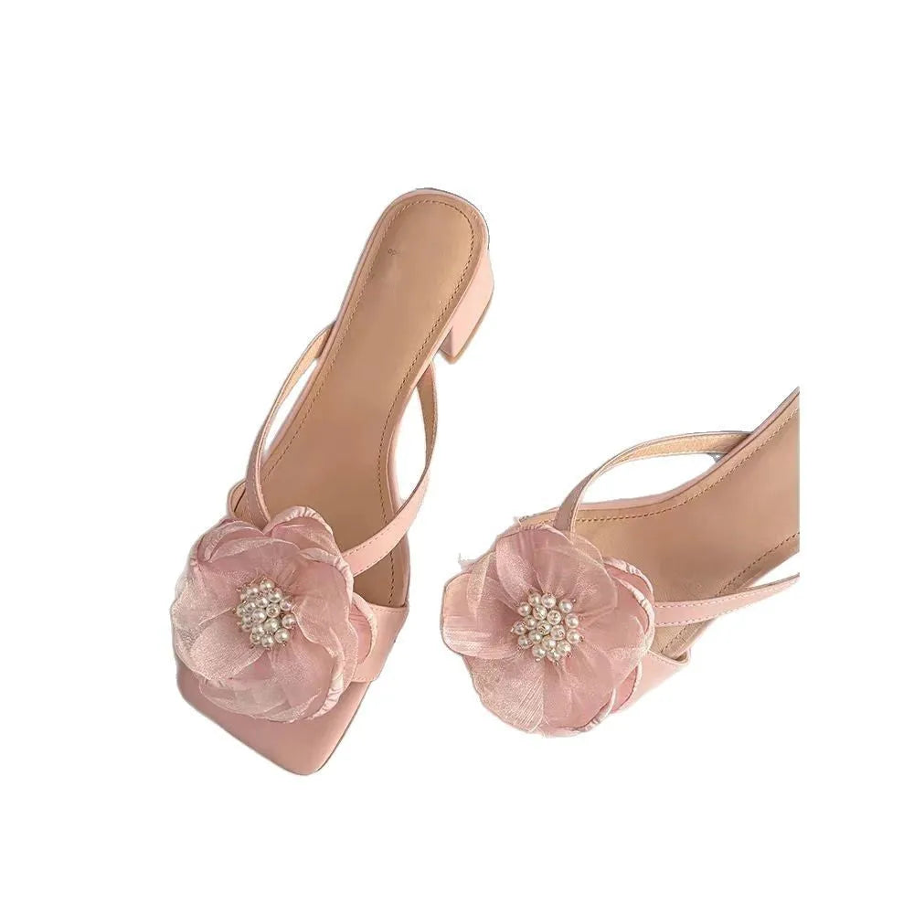 Women's cream-white satin sandals with a chunky block heel, square toe, and a single strap across the foot.