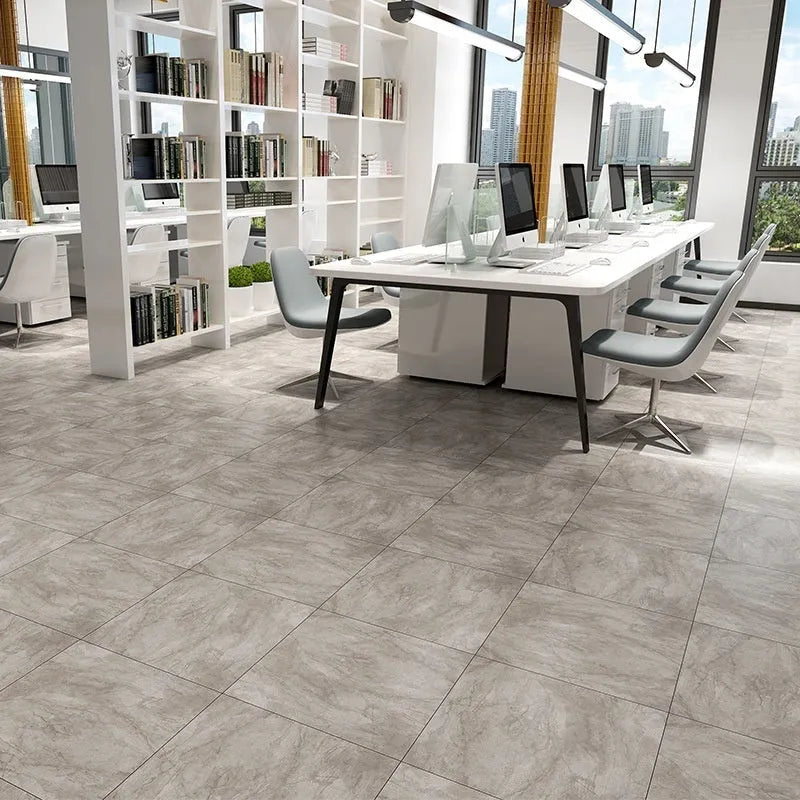 Self-adhesive PVC floor sticker 30cm x 30cm marble pattern in grey on a kitchen floor