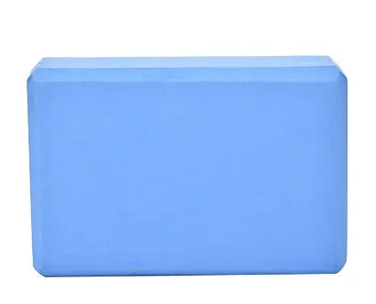 Pure colour EVA yoga brick, thick non-slip mat, and cotton tension band on a floor, in blue, purple, pink, red, black, gray