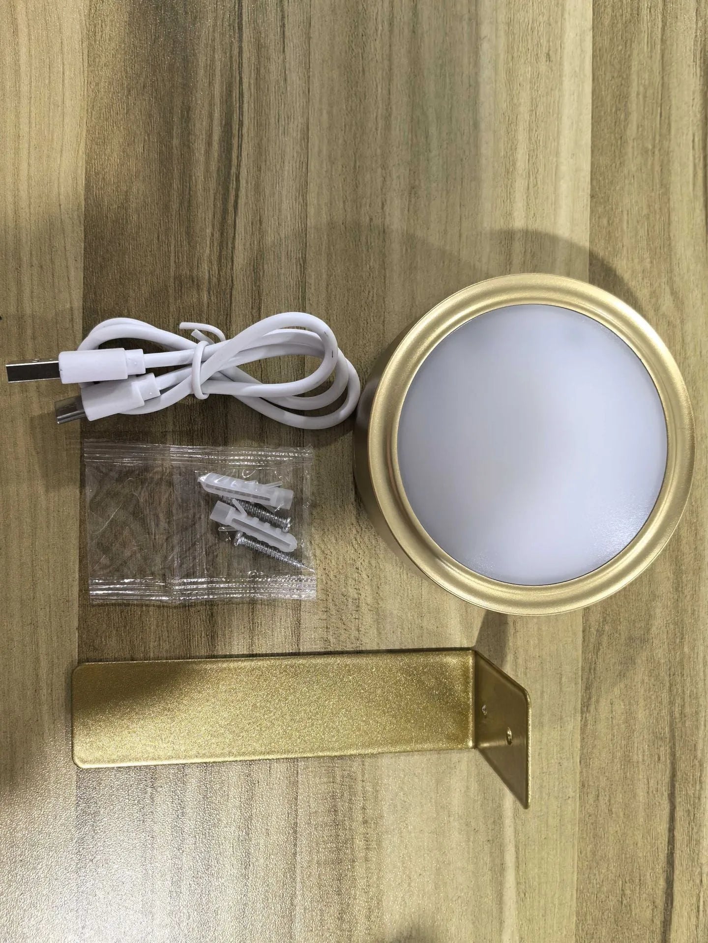 Wireless LED painting lamp with a magnetic mounting belt and remote control in black finish.