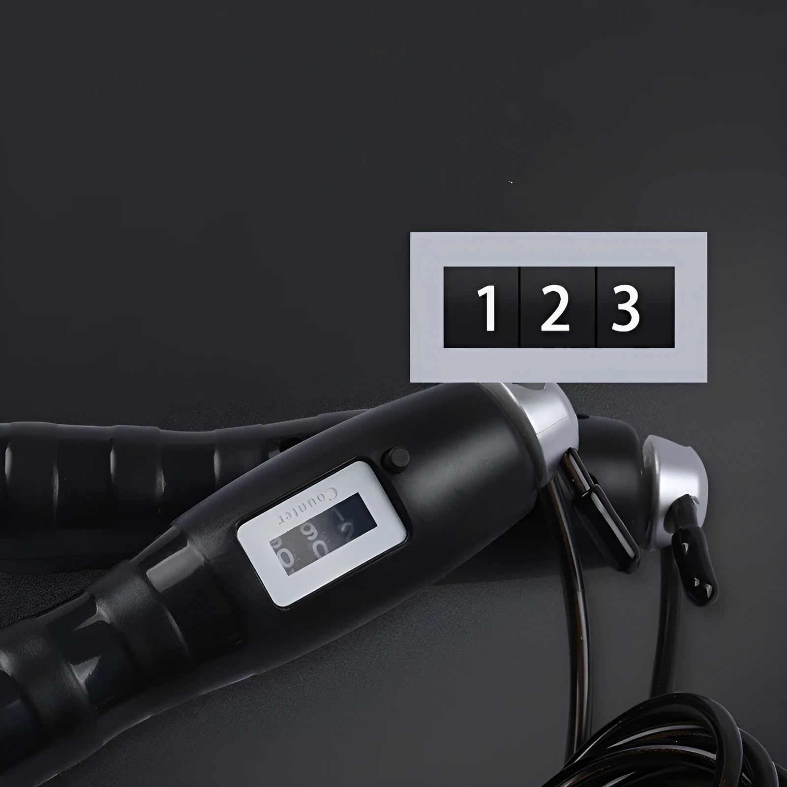 Adjustable digital skipping rope with black ABS handle and coated steel cable on white background