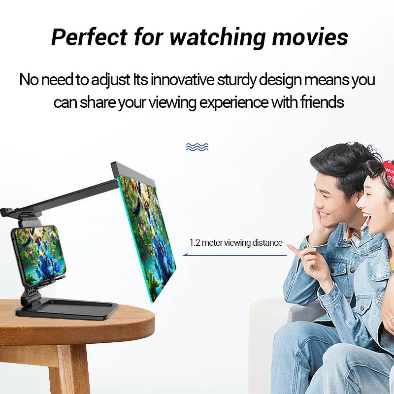 Black folding mobile phone screen magnifier with detachable phone holder on a desk.