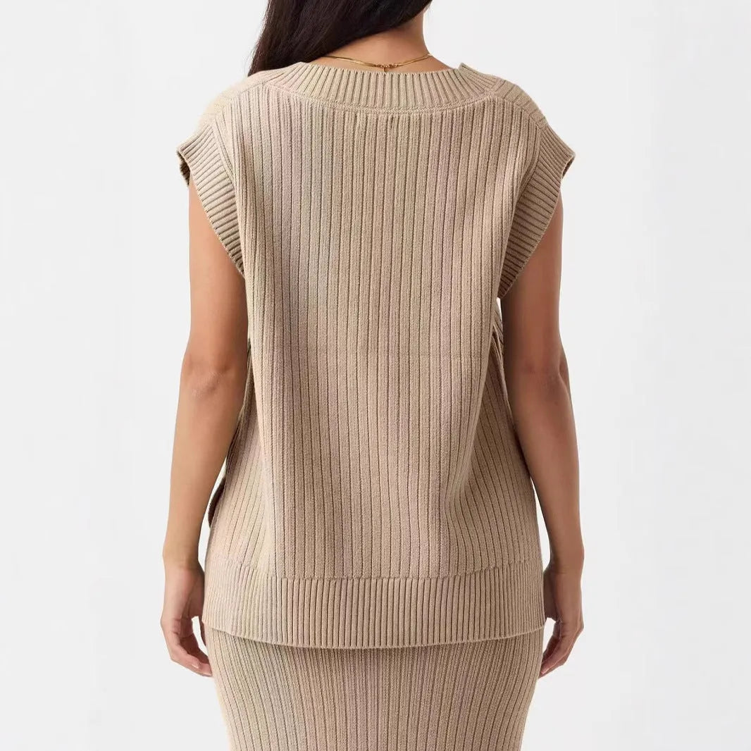 Camel and white loose v-neck sleeveless vest with striped or plaid pattern.
