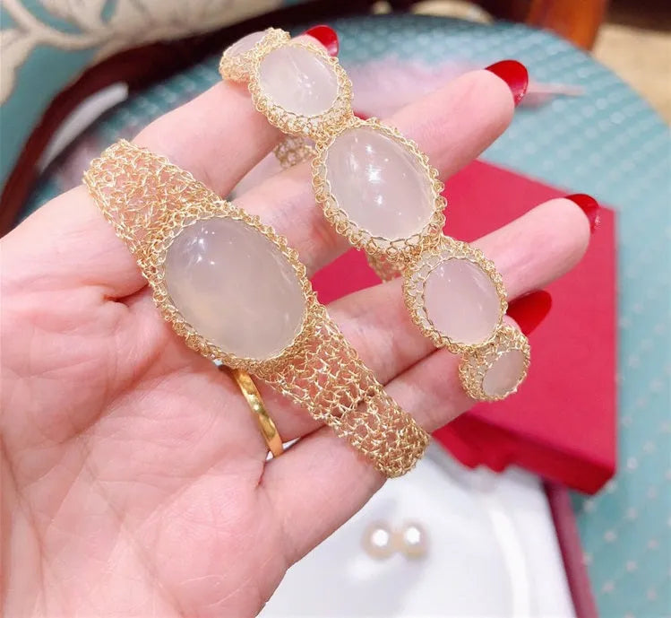 14k gold wire natural white chalcedony bracelet on wrist with adjustable chain closure
