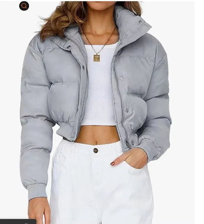 Women's loose-fit polyester jacket in blue, shown with long sleeves and a casual design.