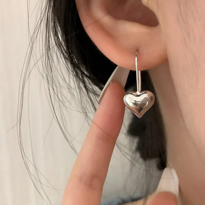 Three-dimensional glossy heart-shaped earrings with Korean style design and silver colour finish