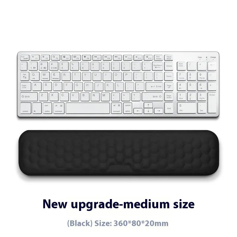 Memory foam mouse wrist rest with silicone base in black cloth and grey leather style options.