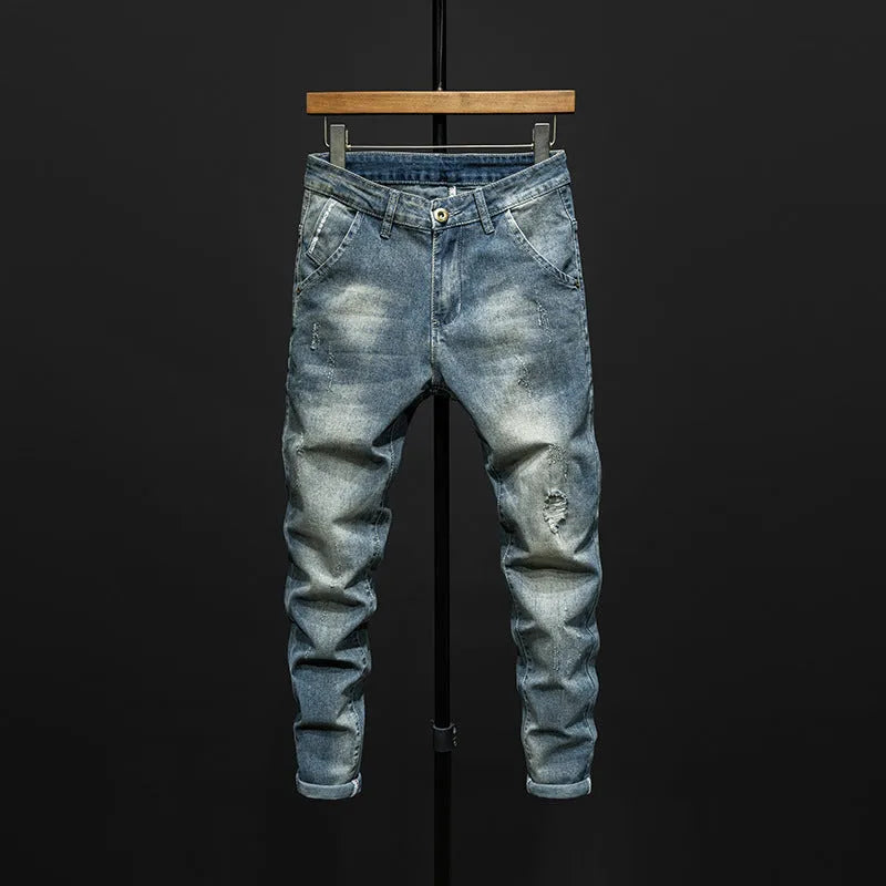 Men's slim-fit blue jeans with micro-elastic denim fabric on hanger