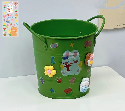 Round metal desktop pen holder showing colour options including green, pink, red, white and yellow