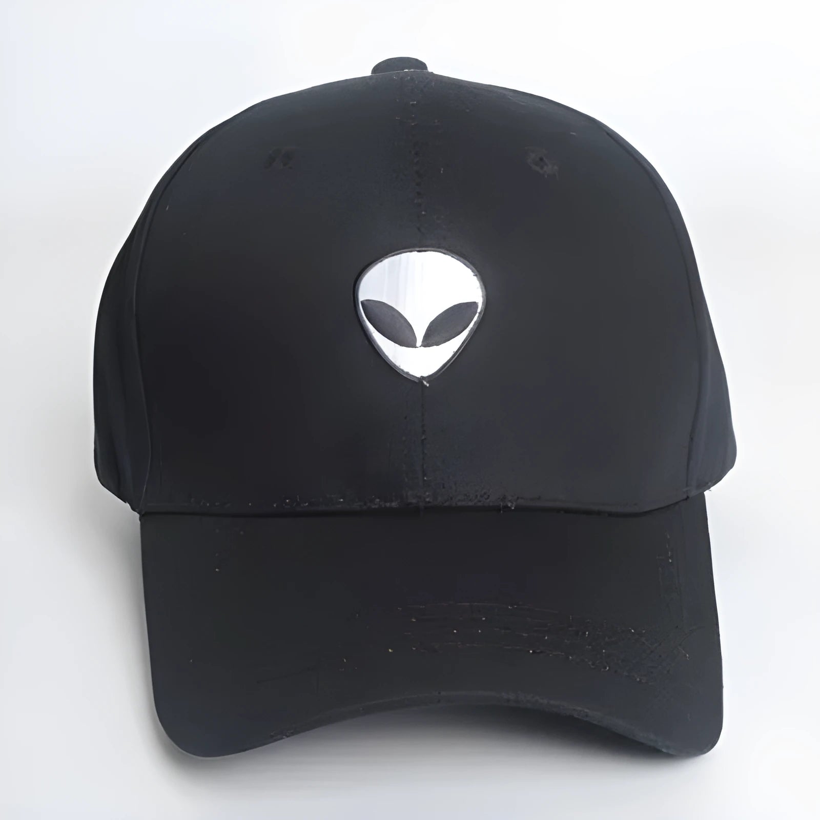Black cotton satin weave baseball cap with embroidered alien head and green label