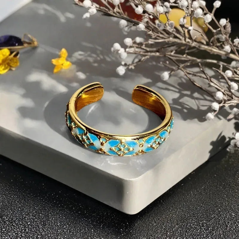 Adjustable copper ring with vintage oil dripping gourd design, zircon inlay, and floral bow shapes in New Chinese style.