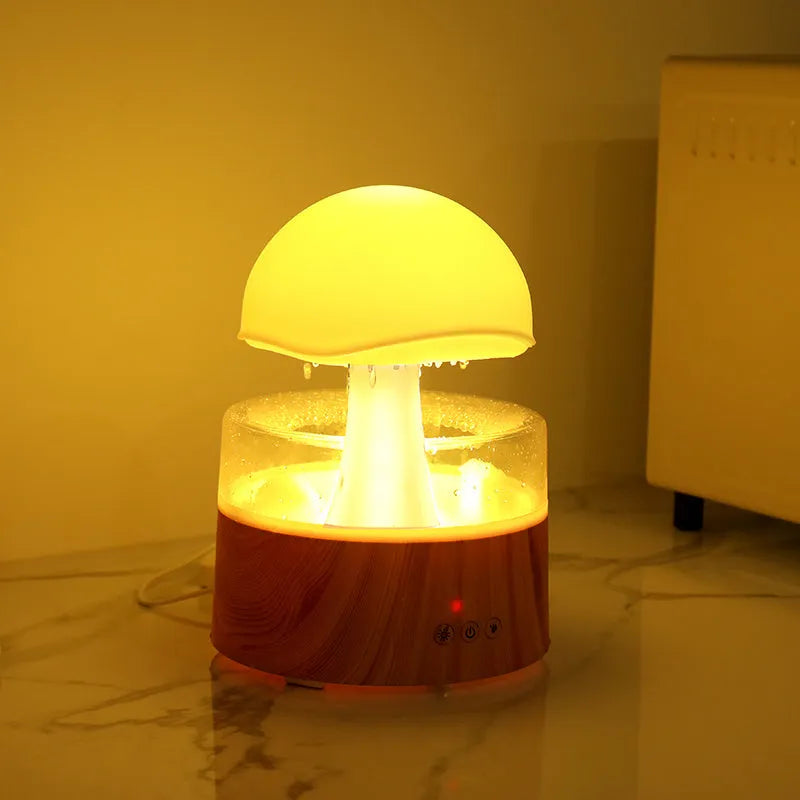 White cloud-shaped ultrasonic humidifier and aroma diffuser with colourful lighting and simulated raindrops