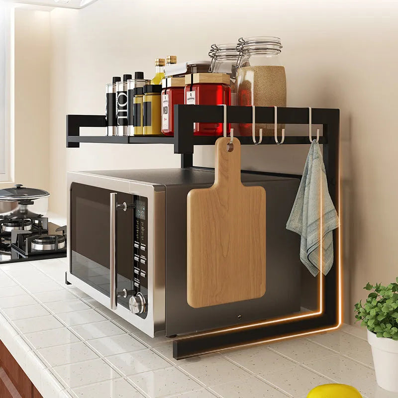 Retractable metal kitchen microwave rack with two layers on a countertop
